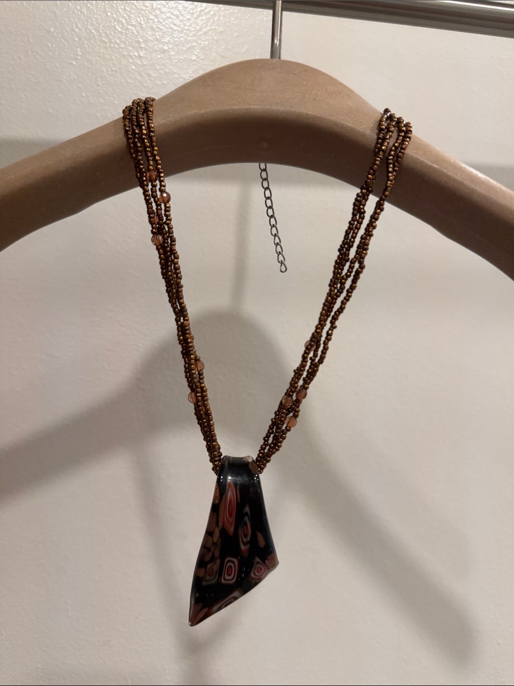 Brown Multi-Strand Beaded Necklace with Patterned Glass Pendant